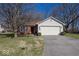Charming single-Gathering home with a two-car garage, set amidst mature trees and a well-maintained lawn at 4238 Vestry Ct, Indianapolis, IN 46237