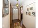 Inviting hallway with a decorative gallery wall, stylish floors and a front door at 4238 Vestry Ct, Indianapolis, IN 46237