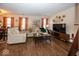 Cozy living room with hardwood floors, neutral paint and furniture, and modern decor at 4238 Vestry Ct, Indianapolis, IN 46237