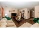 Inviting living room with hardwood floors, a plush sofa, and an entertainment center at 4238 Vestry Ct, Indianapolis, IN 46237