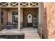 Inviting front porch with comfortable seating, decorative accents, a welcoming wreath, and a charming ambiance at 4287 Prairie Falcon Dr, Zionsville, IN 46077