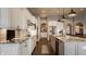 Galley kitchen with granite countertops, stainless steel appliances, and ample cabinet space at 4287 Prairie Falcon Dr, Zionsville, IN 46077