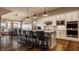 Gourmet kitchen with granite countertops, stainless steel appliances, and a large island with bar seating at 4287 Prairie Falcon Dr, Zionsville, IN 46077