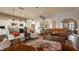 Open-concept living room showcasing hardwood floors, comfortable seating, and seamless transition into a gourmet kitchen at 4287 Prairie Falcon Dr, Zionsville, IN 46077