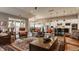 Spacious living area with stylish furniture, natural light, and an open layout into the kitchen and dining areas at 4287 Prairie Falcon Dr, Zionsville, IN 46077
