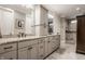 Main bathroom with double vanities, granite countertops, tile flooring, and walk-in shower at 4287 Prairie Falcon Dr, Zionsville, IN 46077