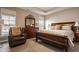 Spacious main bedroom featuring a large bed, dresser, side tables, and natural light at 4287 Prairie Falcon Dr, Zionsville, IN 46077