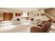 Spacious finished basement with a large sectional couch and a kitchenette at 438 E Vermont St, Indianapolis, IN 46202