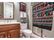 Cozy bathroom with wood vanity, patterned shower curtain, and ample space at 438 E Vermont St, Indianapolis, IN 46202