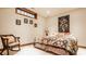 Cozy bedroom with a colorful quilt, decorative pillows, and unique artwork at 438 E Vermont St, Indianapolis, IN 46202