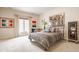 Inviting bedroom featuring a decorative bed, bright window, and art pieces creating a comfortable retreat at 438 E Vermont St, Indianapolis, IN 46202