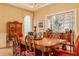 Dining room with wood table, seating for six, and natural light at 438 E Vermont St, Indianapolis, IN 46202