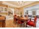 Light-filled dining area with hardwood flooring and elegant chandelier at 438 E Vermont St, Indianapolis, IN 46202