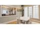 Bright dining area with large windows provides natural light and a view of the neighborhood at 438 E Vermont St, Indianapolis, IN 46202