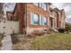 Brick home exterior featuring light blue window shutters and manicured lawn at 438 E Vermont St, Indianapolis, IN 46202