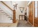 Elegant foyer featuring a staircase, wooden accents, and a stylish entryway at 438 E Vermont St, Indianapolis, IN 46202