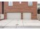 Two-car garage with a paved driveway and brick exterior at 438 E Vermont St, Indianapolis, IN 46202
