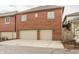 Brick garage exterior featuring two-car garage and paved driveway at 438 E Vermont St, Indianapolis, IN 46202