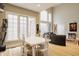 Spacious living area with tall ceilings, large windows, and an adjoining dining area at 438 E Vermont St, Indianapolis, IN 46202