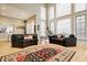 Inviting living area with ample natural light, hardwood floors, and a dining area view at 438 E Vermont St, Indianapolis, IN 46202