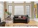 Cozy living room boasts hardwood floors, large windows, and a modern aesthetic at 438 E Vermont St, Indianapolis, IN 46202