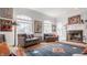 Bright living room with large windows, a decorative fireplace, and comfortable seating at 438 E Vermont St, Indianapolis, IN 46202