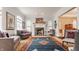 Cozy living room featuring a fireplace, large windows, and comfortable seating at 438 E Vermont St, Indianapolis, IN 46202