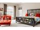 Bright main bedroom with a large arched window, creating a warm and inviting atmosphere at 438 E Vermont St, Indianapolis, IN 46202