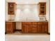 Basement wet bar with wooden cabinets and a built-in microwave at 438 E Vermont St, Indianapolis, IN 46202