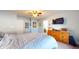 Spacious bedroom featuring a comfortable bed, ceiling fan, and ample natural light at 4618 Angelica Dr, Indianapolis, IN 46237