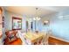 Cozy dining room with hardwood floors, a decorative mirror, and dining table at 4618 Angelica Dr, Indianapolis, IN 46237