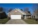 Charming one-story home with brick facade, two-car garage, and well-maintained front yard at 4618 Angelica Dr, Indianapolis, IN 46237