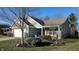 Charming home with a well-maintained lawn, attached garage, and inviting curb appeal at 4618 Angelica Dr, Indianapolis, IN 46237