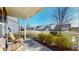 Comfortable front porch with wooden chairs, beautiful landscaping, and a welcoming view at 4618 Angelica Dr, Indianapolis, IN 46237
