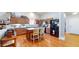 Well-lit kitchen with center island, black appliances, and wooden cabinets at 4618 Angelica Dr, Indianapolis, IN 46237
