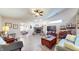 Bright living room featuring a stone fireplace, ceiling fan, and modern decor at 4618 Angelica Dr, Indianapolis, IN 46237