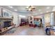 Spacious living room with a stone fireplace, laminate wood floors, and an open layout at 4618 Angelica Dr, Indianapolis, IN 46237