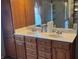 Bathroom showcasing a double sink vanity, framed mirror and shower and tile flooring at 4823 S State Road 75, Jamestown, IN 46147