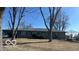 View of the ranch style home with a metal roof from across the front yard at 4823 S State Road 75, Jamestown, IN 46147