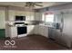 Bright kitchen with stainless steel appliances, white cabinetry, and eat-in breakfast nook at 4823 S State Road 75, Jamestown, IN 46147
