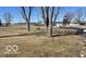 View of a large sunny yard with a house in the background at 4823 S State Road 75, Jamestown, IN 46147