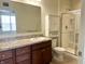 A bathroom with a single sink vanity, and a glass shower enclosure at 4889 Lilium Dr, Plainfield, IN 46168