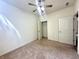 This carpeted bedroom features a ceiling fan and a closet at 4889 Lilium Dr, Plainfield, IN 46168