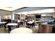 Inviting clubhouse lounge area with a fireplace, TV, library, and seating arrangement for relaxation and socializing at 4889 Lilium Dr, Plainfield, IN 46168