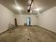 The spacious two car garage features concrete floors and automatic door at 4889 Lilium Dr, Plainfield, IN 46168