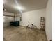 A garage with a white bicycle and green waste bins at 4889 Lilium Dr, Plainfield, IN 46168