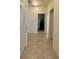 A hallway with multiple doorways leading to other rooms at 4889 Lilium Dr, Plainfield, IN 46168