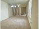 Large living room with carpeting, big windows and simple lighting fixtures at 4889 Lilium Dr, Plainfield, IN 46168