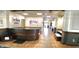 A view of the lobby showcasing a reception area, hardwood floors, and stylish decor at 4889 Lilium Dr, Plainfield, IN 46168
