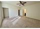 Main bedroom featuring neutral carpeting, closet, and en-suite bathroom at 4889 Lilium Dr, Plainfield, IN 46168